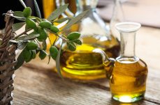 olive-oil-and-olive-twig-on-a-table-2021-08-26-16-34-05-utc (2) (1)