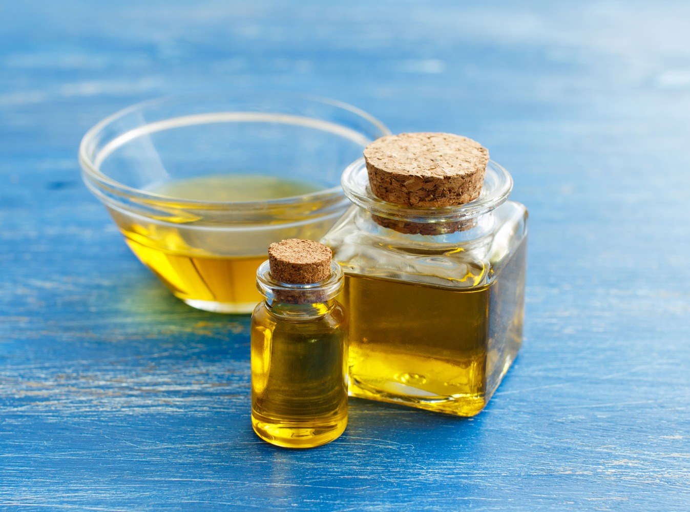 olive-oil-in-bottles-on-a-blue-background-2021-08-26-15-46-40-utc-1-1.jpg