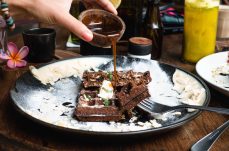 pouring-maple-syrup-on-chocolate-waffle-2021-08-27-12-01-37-utc (1) (1)